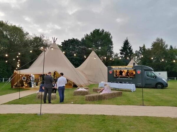 Stonebakers catering a wedding at a teepee tent