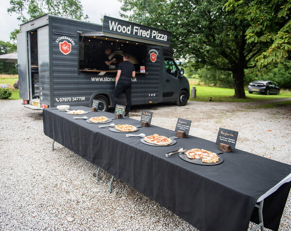 Stonebakers van behind full buffet table