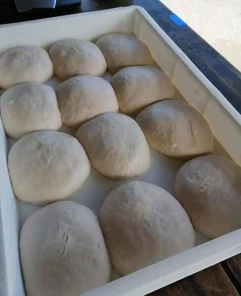 fresh dough balls in white tray